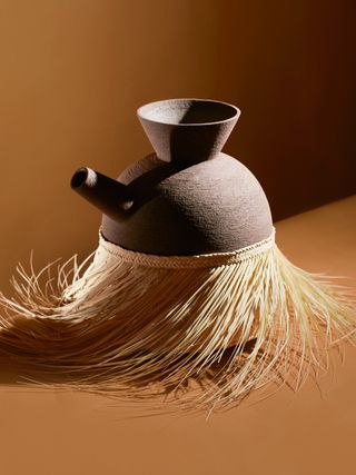 Pot in grass skirt, by Studiopepe