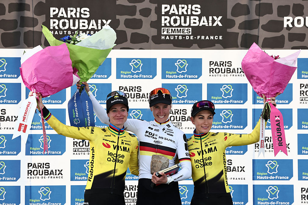 Marianne Vos, Franziska Koch and Pauline Ferrand-Pr&eacute;vot celebrate on the podium of the 6th edition of the Women Paris-Roubaix 2026