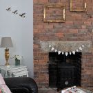 fireplace with wood burning stove and bunting