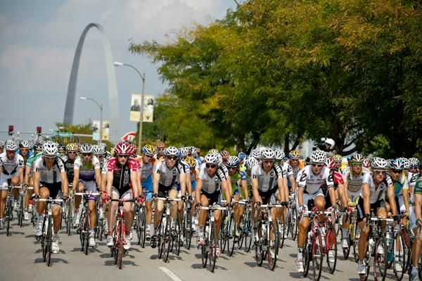 Riders head under the back drop of the St. Louis arch.