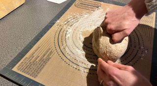 Wholemeal dough being kneaded on a Lazymi silicone baking mat