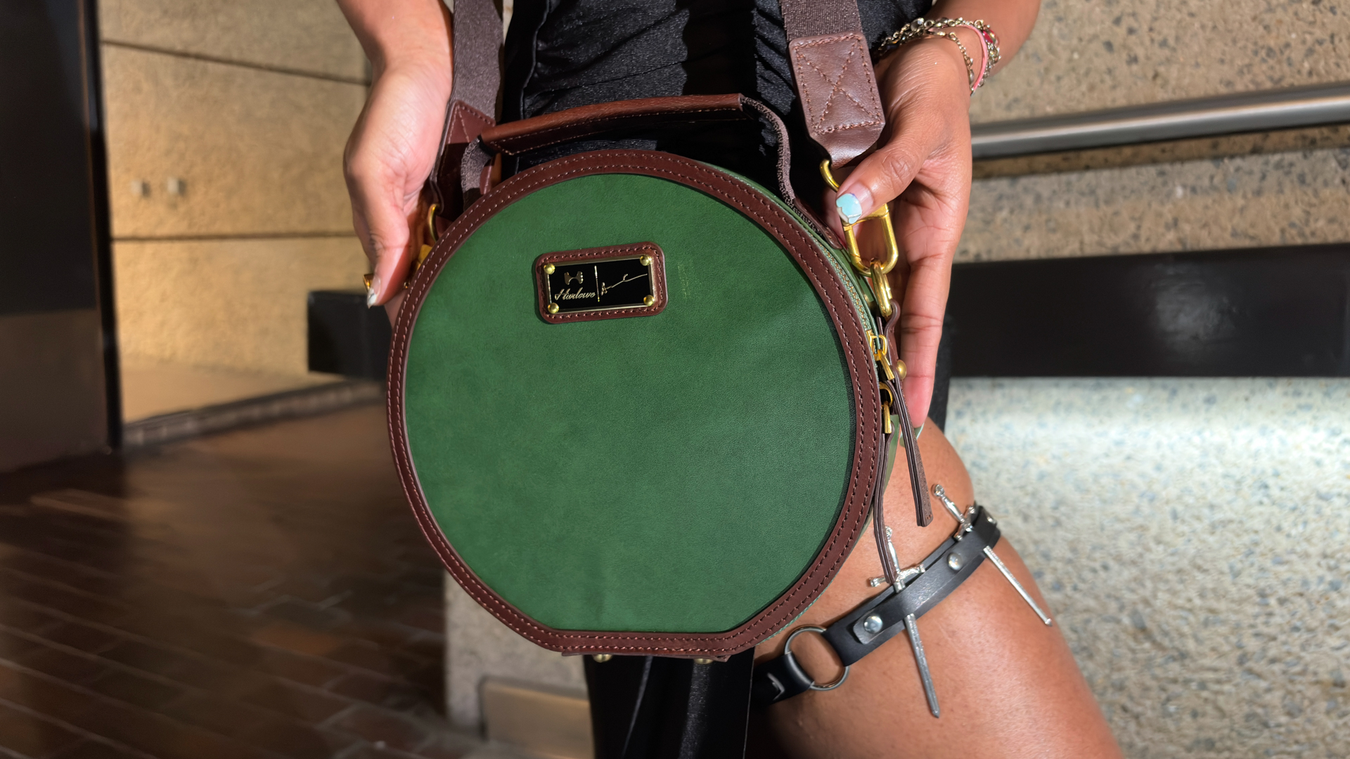 The circular pine-green leather of the Sol 30&amp;rsquo;s carry case