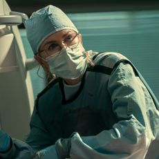 nicole kidman as kay scarpetta in scrubs and a mask doing an autopsy in prime video's scarpetta