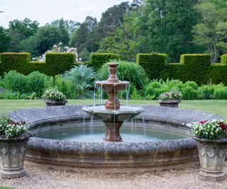 Tiered fountain in English garden