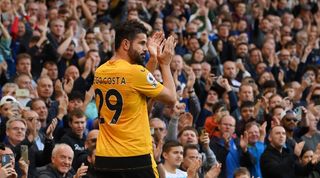 Diego Costa applauds the Chelsea fans and is clapped by Blues supporters on his return to Stamford Bridge with Wolves.