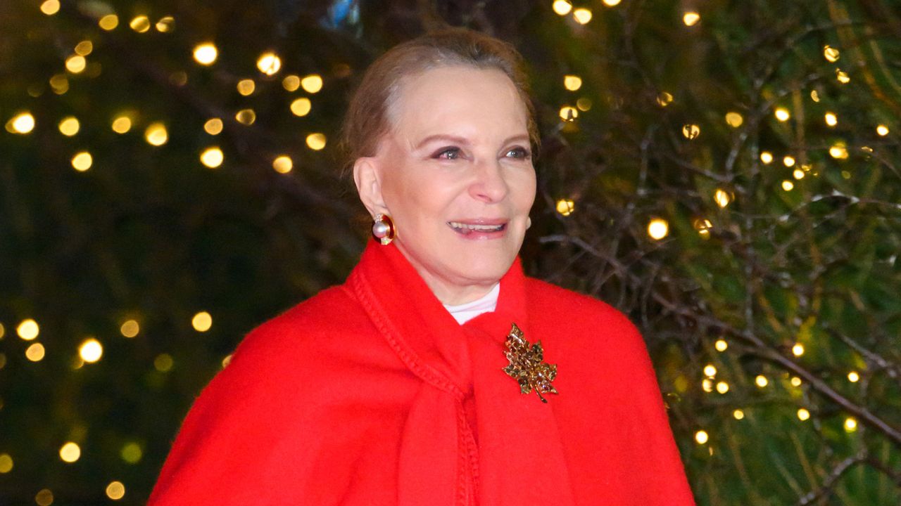 Princess Michael of Kent wears an oversized bright red shawl with a brooch for Princess kate&#039;s carol concert