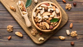 Collection of nuts in a bowl, some of the best foods to eat after a workout
