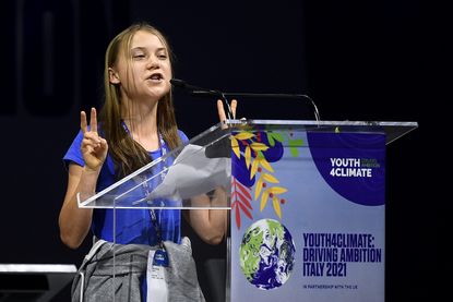 Greta Thunberg gestures during opening plenary session of