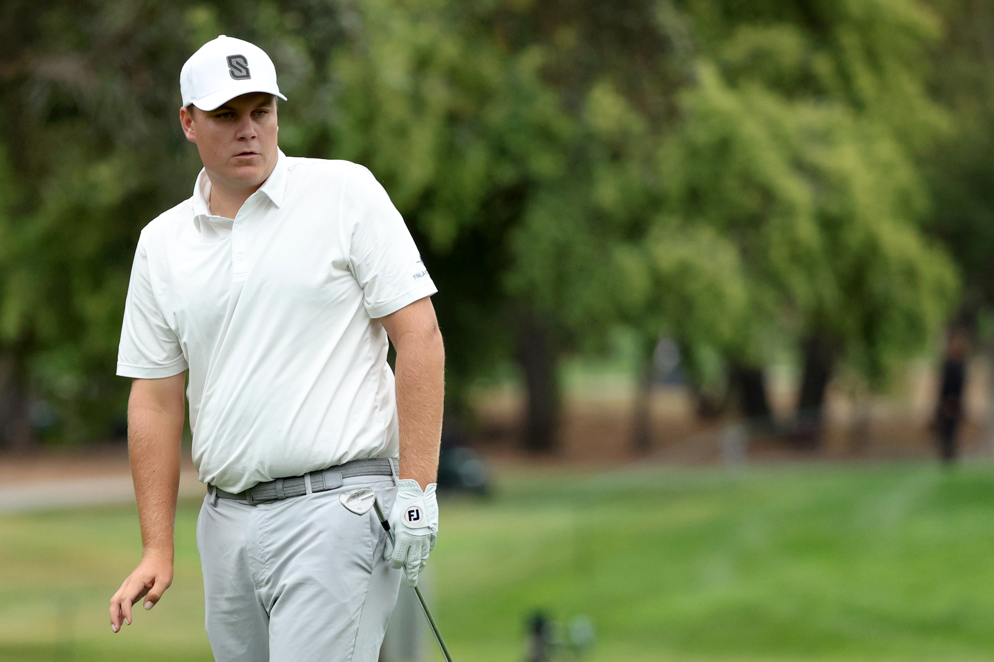 Sami Valimaki hits a wedge shot from off the green