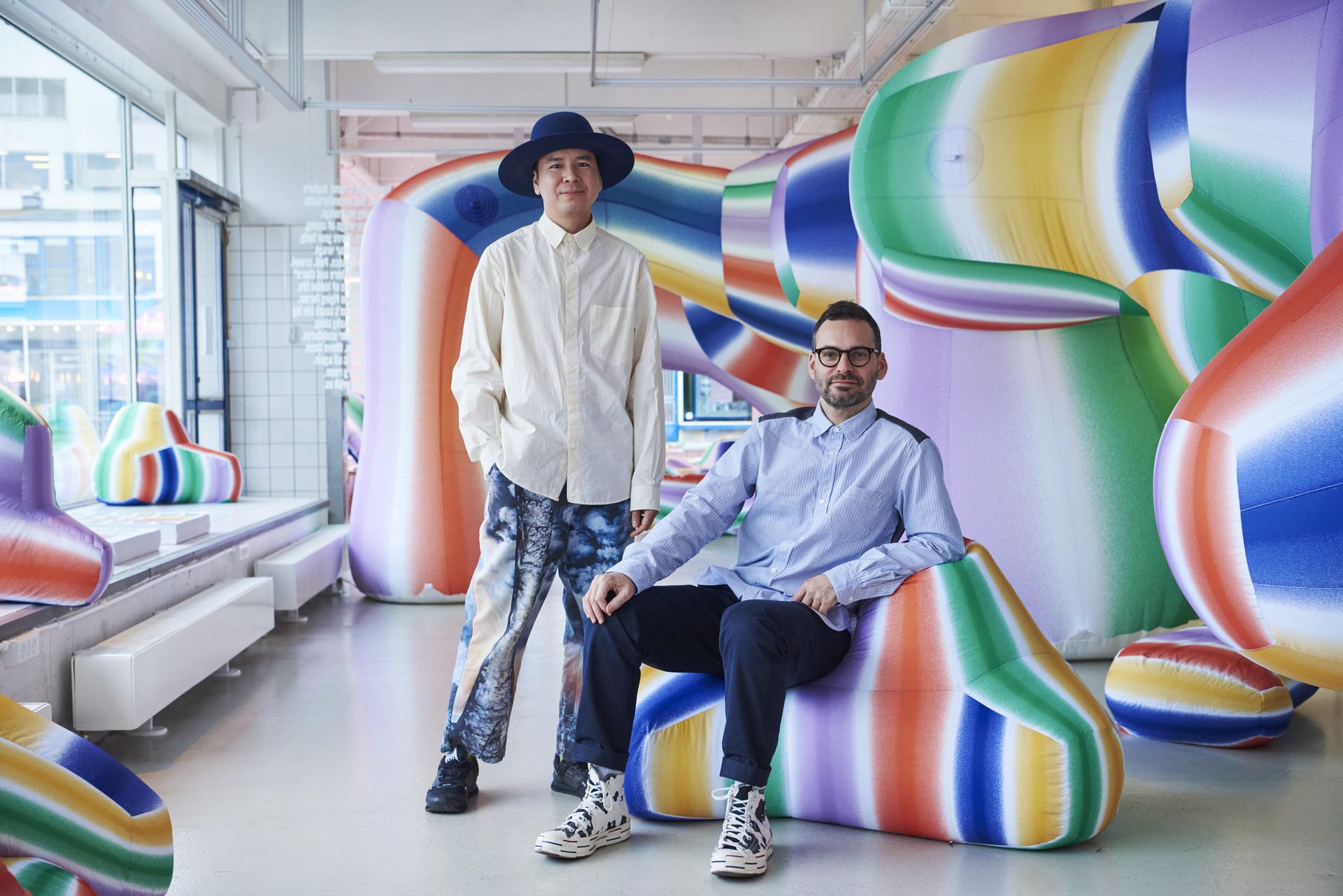 Both are sitting on the couch