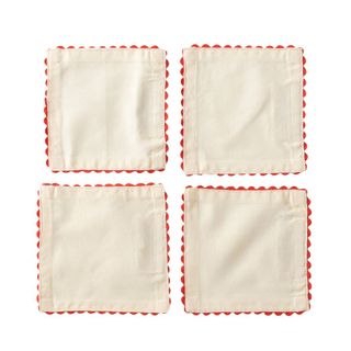 A set of four scalloped napkins