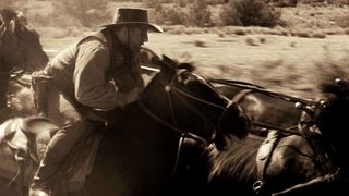 A cowboy charging into battle from True Grit in The Real Story.