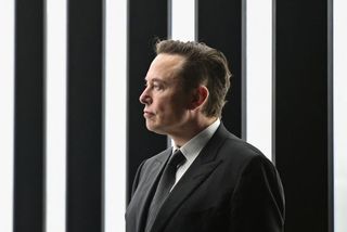 Tesla CEO Elon Musk is pictured as he attends the start of the production at Tesla's "Gigafactory" on March 22, 2022 in Gruenheide, southeast of Berlin. 