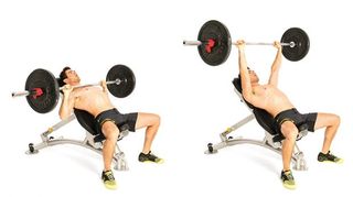 A man demonstrates an incline bench press chest exercise