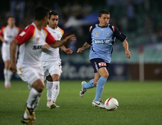 Juninho (right) on the ball for Sydney FC against Adelaide United in October 2007.