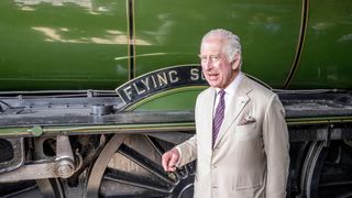 King Charles III arrives by train pulled by the Flying Scotsman into Pickering
