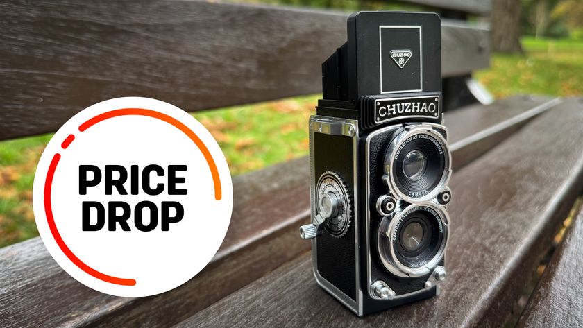 Chuzhao TLR camera on a wooden bench with the text balloon &quot;Price Drop&quot;