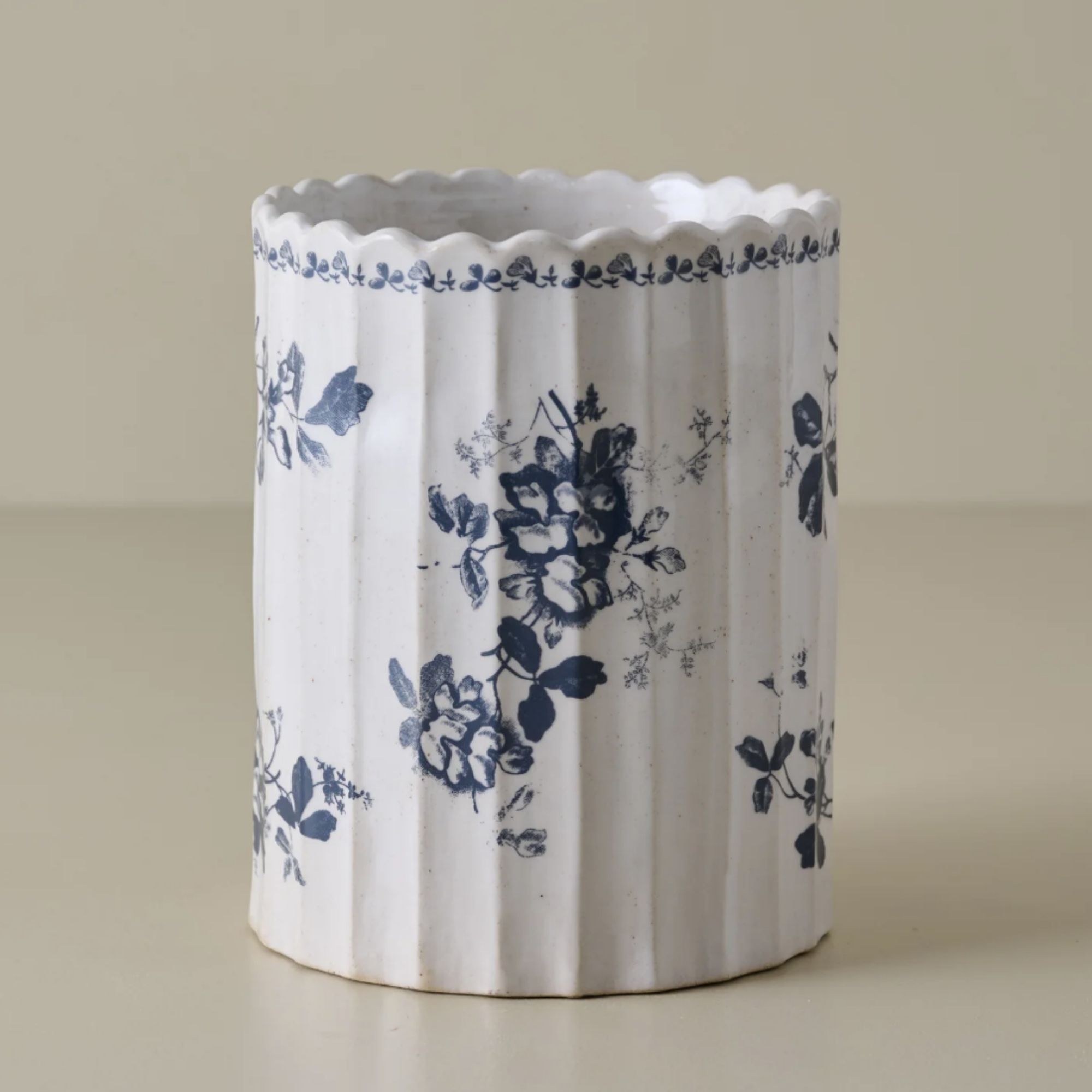 White ribbed utensil crock with blue floral motif