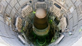 We see the top of a Titan II nuclear missile in its silo in Arizona