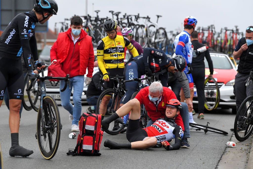 NOKERE BELGIUM MARCH 17 Tim Naberman of Netherlands and Team DSM Xandres Vervloesem of Belgium and Team Lotto Soudal during the 75th Nokere Koerse Danilith Classic 2021 Mens Elite a 1955km race from Deinze to Nokere Crash Injury NokereKoerse on March 17 2021 in Nokere Belgium Photo by Luc ClaessenGetty Images