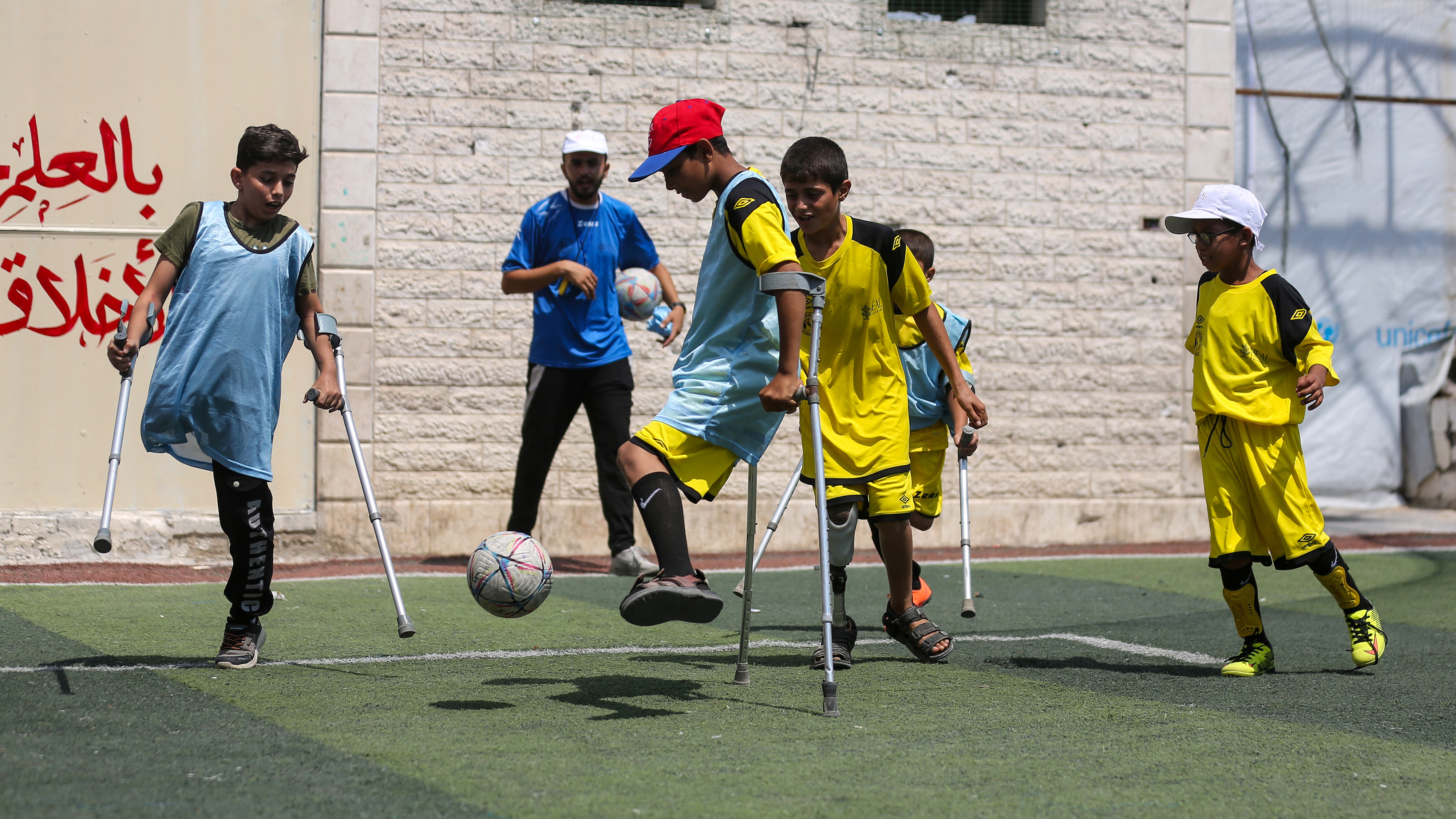 GAZA CITY, GAZA - AUGUST 8: Child amputees attend a football academy organised by the Palestine Amputee Football Association on August 8, 2026 at the Ebad Al-Rahman school in the Saftawi area in northern Gaza City, Gaza. The participants are children who lost limbs due to the Israel-Hamas war and from other accidents. (Photo by Ahmad Hasaballah/Getty Images)