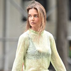 Katie Holmes wears a green lace see-through top