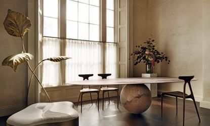 Roisin Lafferty's new gallery - a dining space with sculptural ball-base dining table