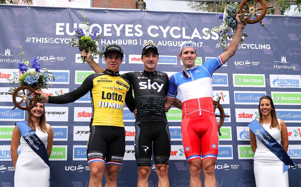The podium pose for the photos