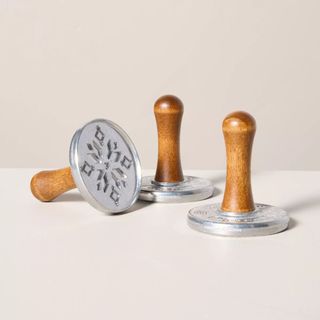 Christmas Cookie Stamps against a beige background. 