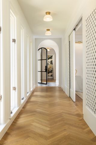 hallway with persian inspired doors and white walls
