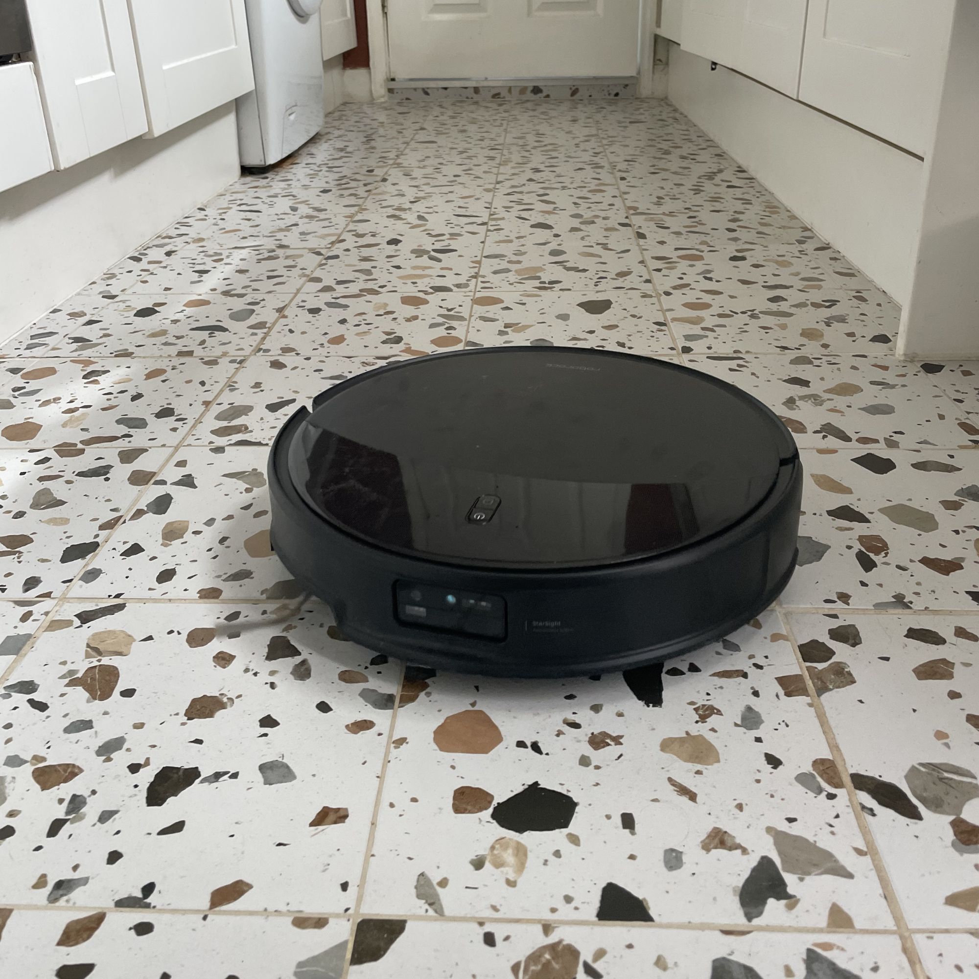 Roborock Saros 20 Robot Vacuum cleaning terrazzo tiled floor in a kitchen