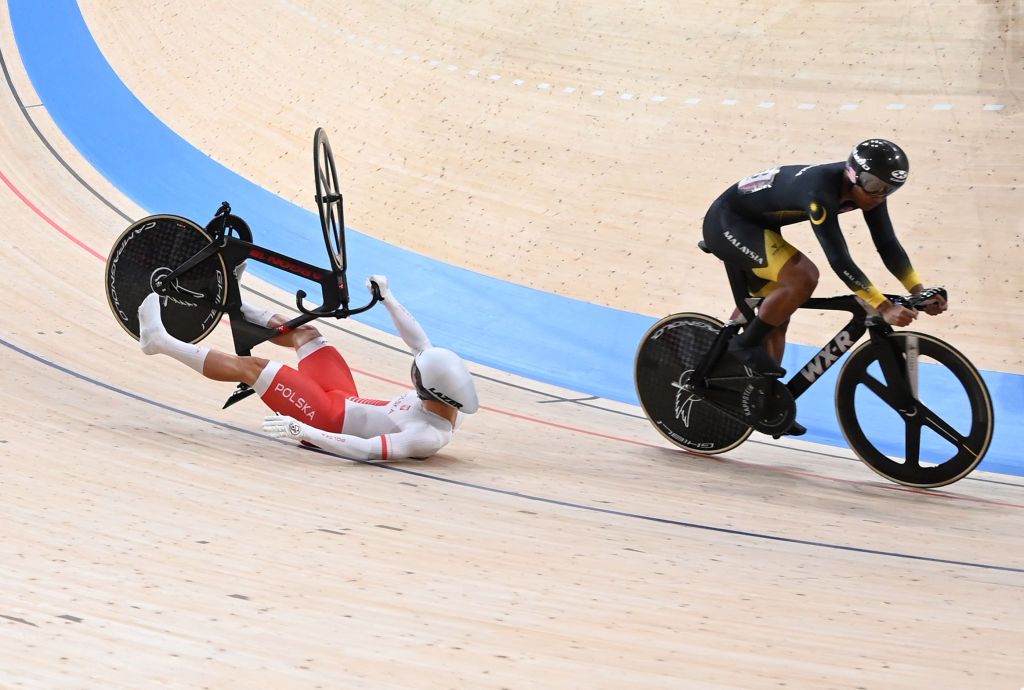 Polands Patryk Rajkowski crashes next to Malaysias Muhammad Shah Firdaus Sahrom during a heat of the mens track cycling sprint 116 finals repechages during the Tokyo 2020 Olympic Games at Izu Velodrome in Izu Japan on August 4 2021 Photo by Peter PARKS AFP Photo by PETER PARKSAFP via Getty Images