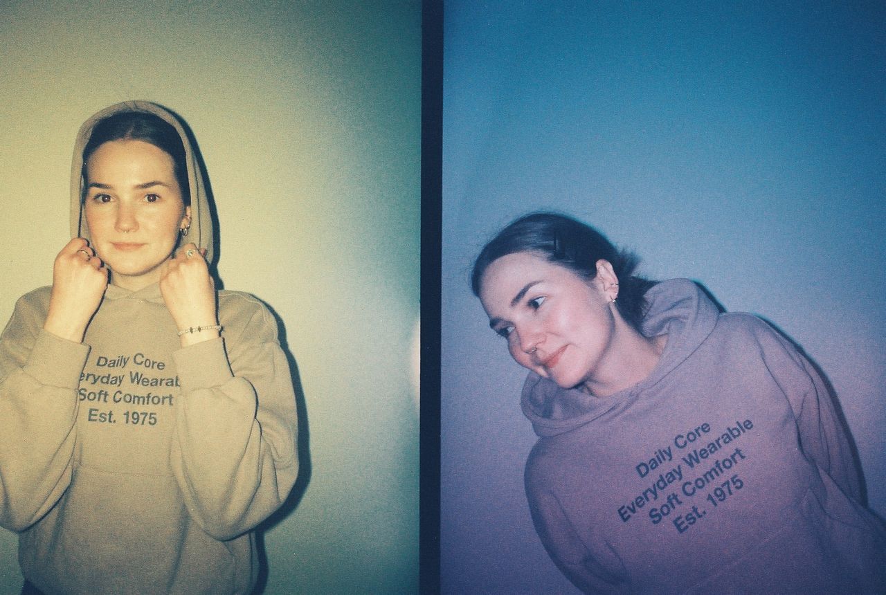 Sample images from the Lomography Half-frame Simple Use Reloadable Film Camera, side by side vertical frames showing a young woman lit with differently colored flash