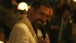 Max Cady smiling and talking into microphone in Cape Fear TV show