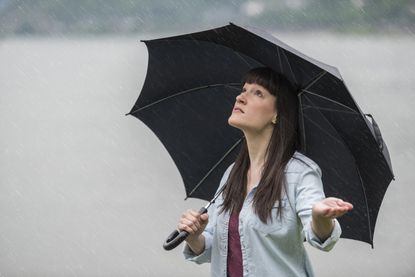 Woman under umbrella in the rain