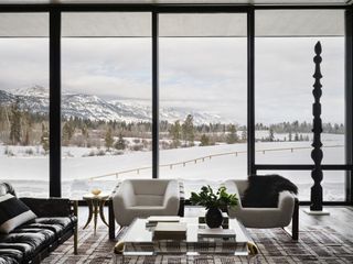 living space looking out to snowy nature at jackson hole retreat