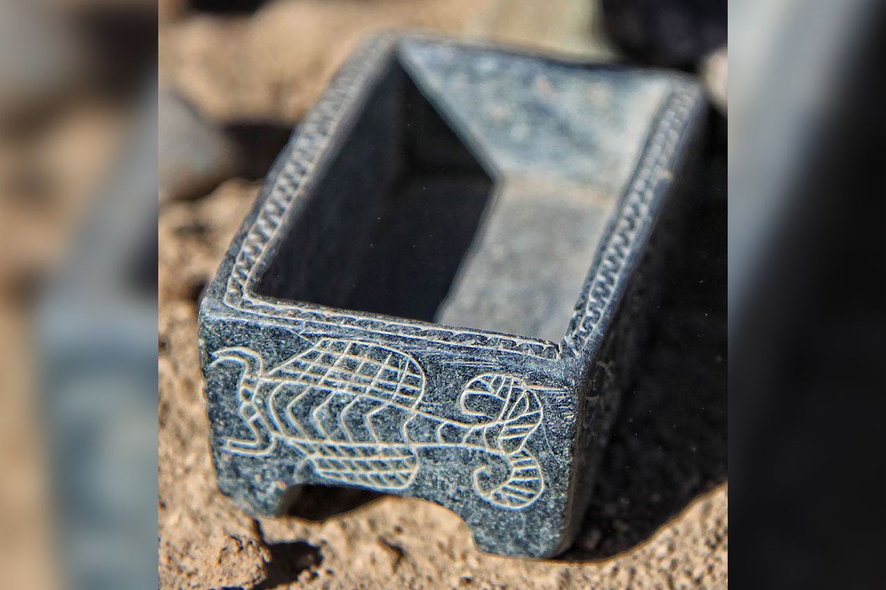 a close-up of an engraved blue box