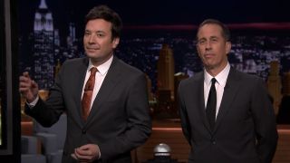 A screenshot from the Tonight Show of Jimmy Fallon and Jerry Seinfeld standing next to each other.