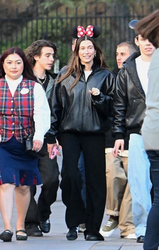 Justin Bieber, Hailey Bieber, and The Kid LAROI enjoy an evening at Disneyland. The group donned Mickey ears and were accompanied by four bodyguards as they made their way through the park, enjoying many of the thrill rides, including Space Mountain and Pirates of the Caribbean.