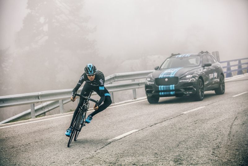 Chris Froome is followed by Sky's new Jaguar F-PACE