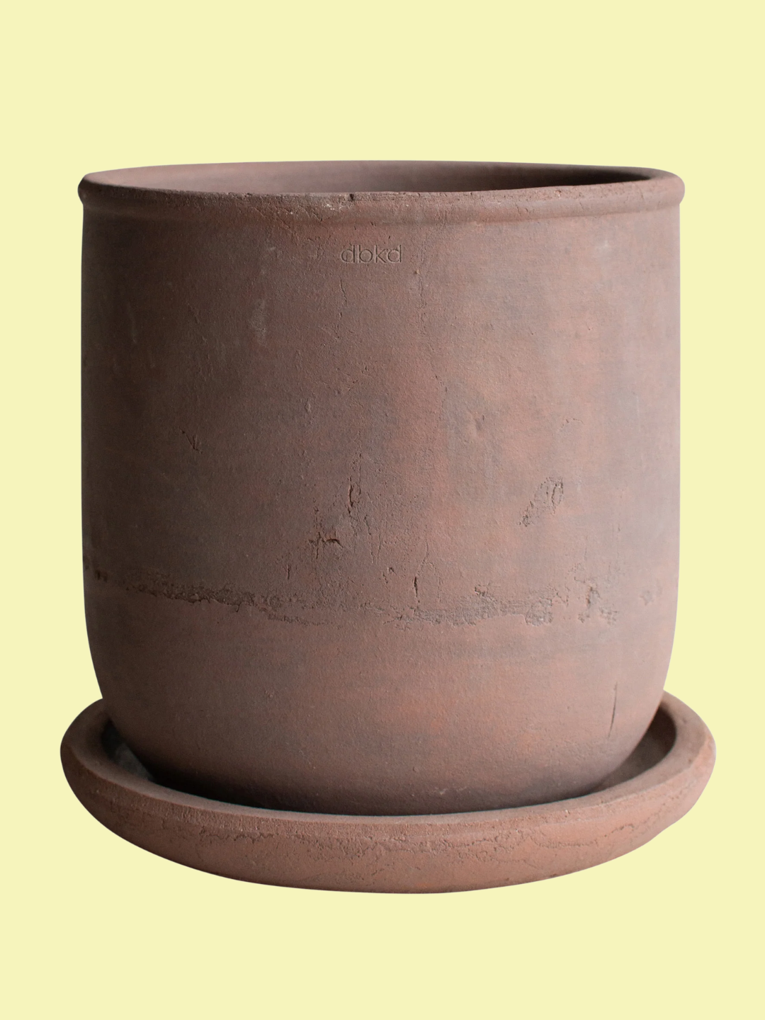An outdoor terracotta pot and saucer from DBKD