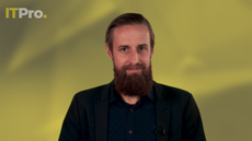 Presenter Ant Joblin on a yellow background talking to the camera