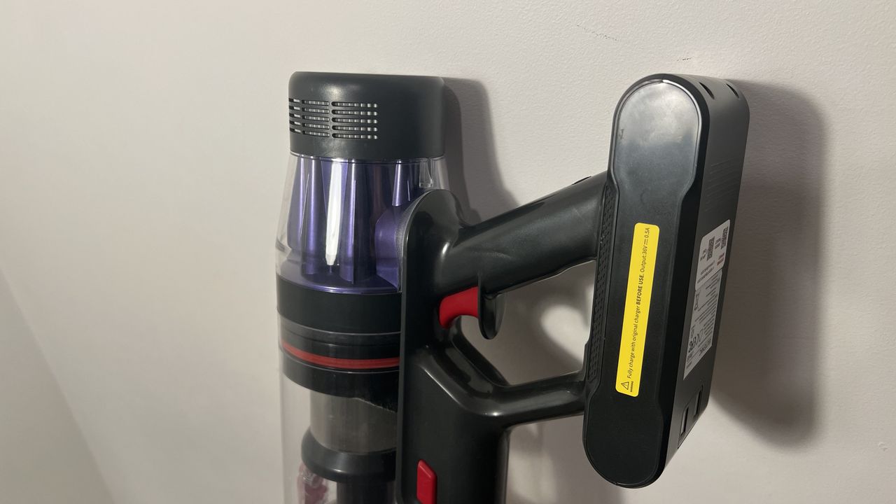 Ultenic U16 Flex vacuum propped up against a wall