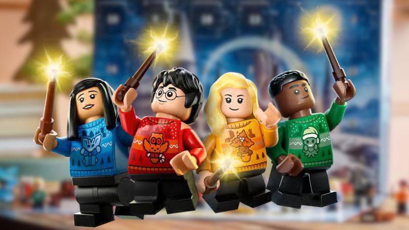 Lego Harry Potter character minifigures raising their wands against a blurred background of the set box