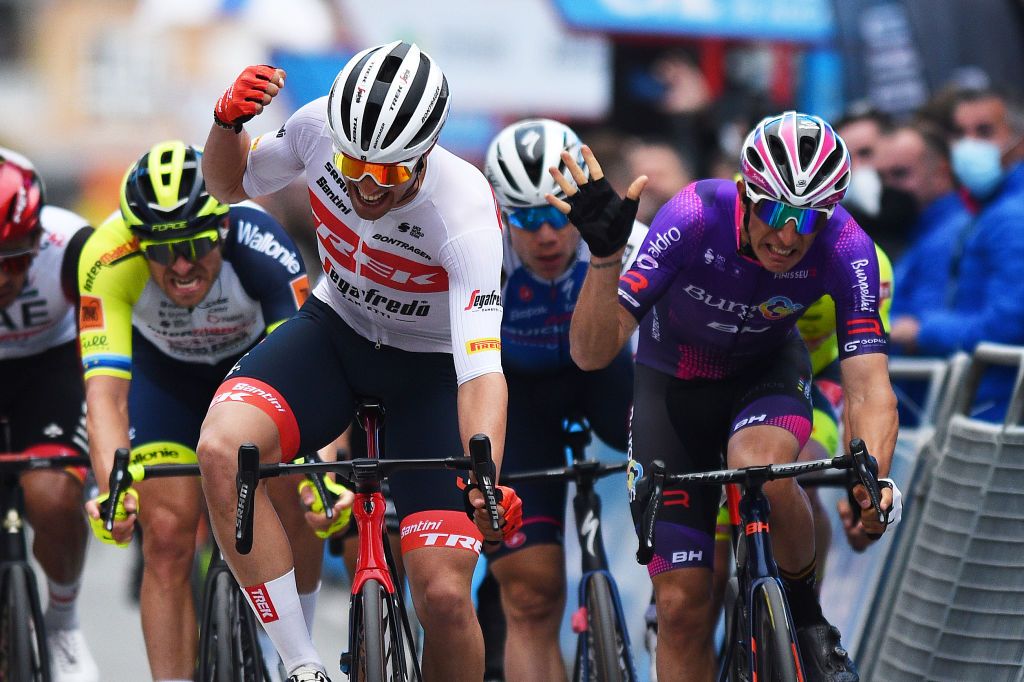 TORREVIEJA SPAIN FEBRUARY 05 Matteo Moschetti of Italy and Team Trek Segafredo celebrates winning ahead of Manuel Penalver Aniorte of Spain and Team Burgos BH and Alexander Kristoff of Norway and Team Intermarch Wanty Gobert Matriaux during the 73rd Volta A La Comunitat Valenciana 2022 Stage 4 a 1931km stage from Orihuela to Torrevieja VCV2022 on February 05 2022 in Torrevieja Spain Photo by Dario BelingheriGetty Images