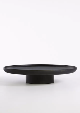 Black pedestal coffee table.