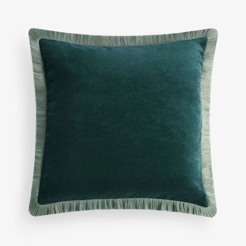 teal cushion with fringe edge