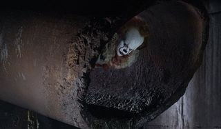 IT Pennywise hanging in a sewer pipe