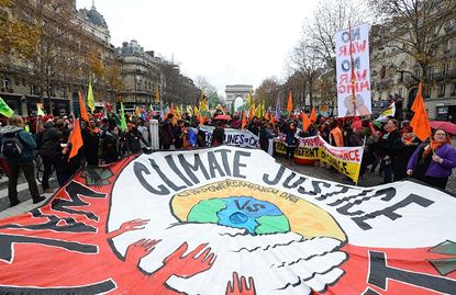 Demonstrators in France advocate for a climate change deal as negotiators participate in Paris talks.