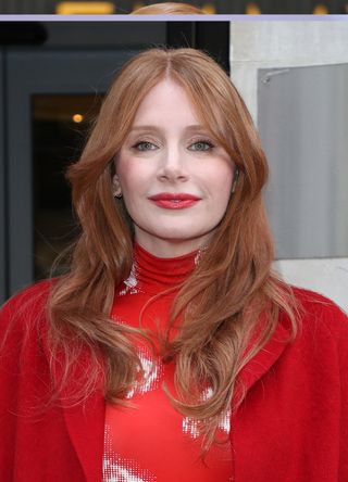 Bryce Dallas Howard with copper eyes and glossy red lips